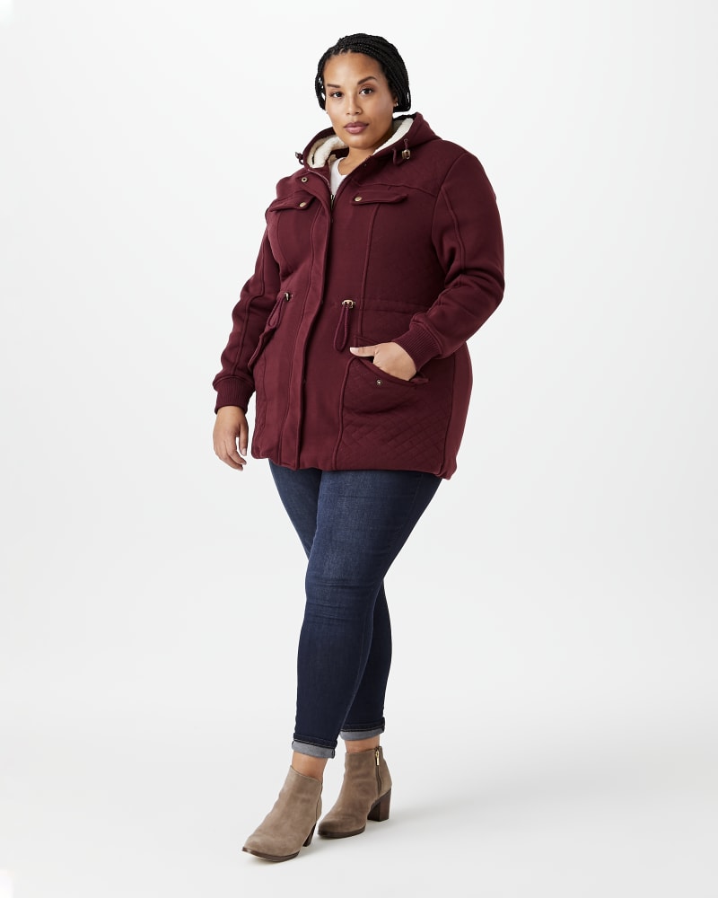 Plus size model with hourglass body shape wearing Primrose Quilted Hooded Jacket by Prescott New York | Dia&Co | dia_product_style_image_id:144373